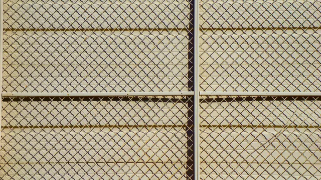 Galvanized chain link fence along a side yard in Edina, MN
