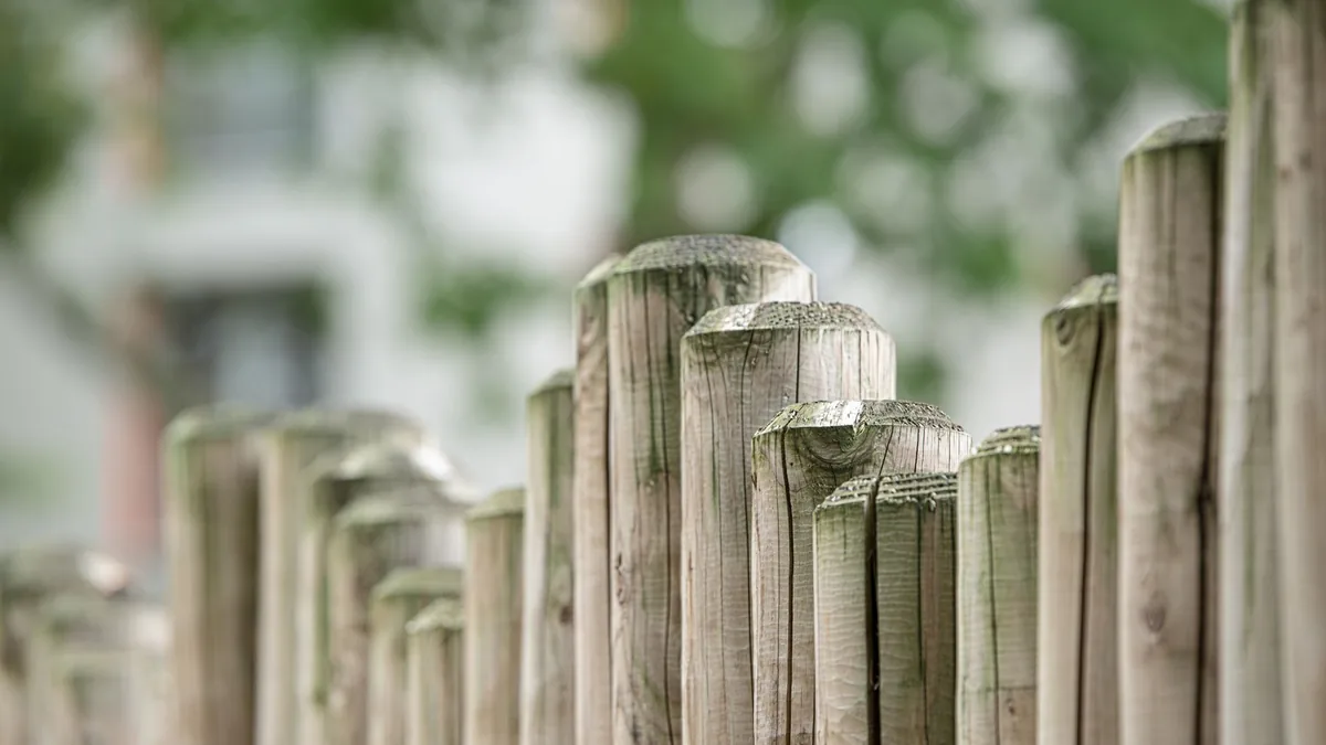 Fence installation crew building a wood fence in Edina, MN