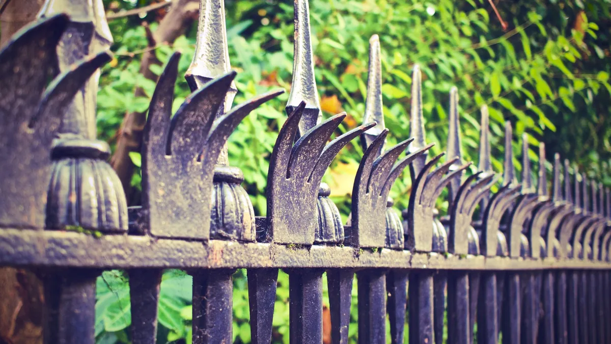 Black aluminum ornamental fence around a front yard in Edina, MN