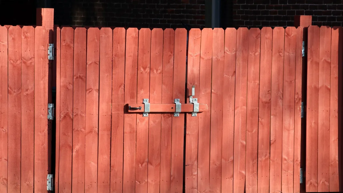 Newly installed wood privacy fence in a backyard in Edina, MN